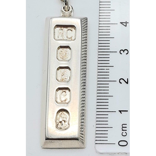 920 - Hallmarked Silver Ingot Pendant on Necklace.
Necklace measures 46cm in length, ingot pendant measure... 