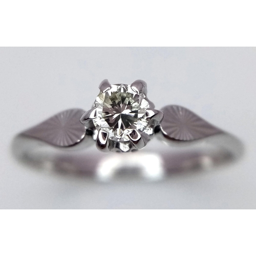 206 - An 18 Carat White Gold Diamond Set Solitaire Ring Size N. Approx .10-.12 Carats. Ring Gross Weight 2... 