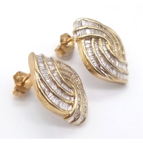 609 - A Pair of 9K Yellow Gold Diamond Swirl Earrings. Baguette diamonds - 2.5ct approx. Boxed. Ref:6942