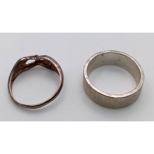 663 - Two Sterling Silver Rings. One band ring with full hallmarks on the front. One hands joining ring, S... 