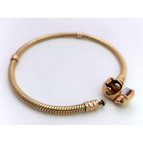 69 - A 14 K yellow gold PANDORA bracelet from the MOMENTS collection. Total weight: 17.1 g. Fashionable a... 