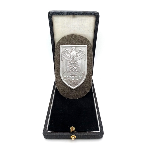 89 - WW2 German Heer (Army) Cholm Campaign Shield in presentation case. Silvered Steel (Magnetic).