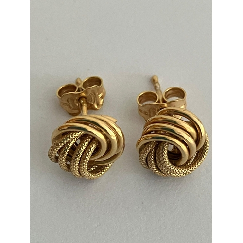 118 - Beautiful pair of 9 carat ‘WOOLMARK’ KNOT GOLD EARRINGS. Complete with 9 carat gold backs. Full UK h... 