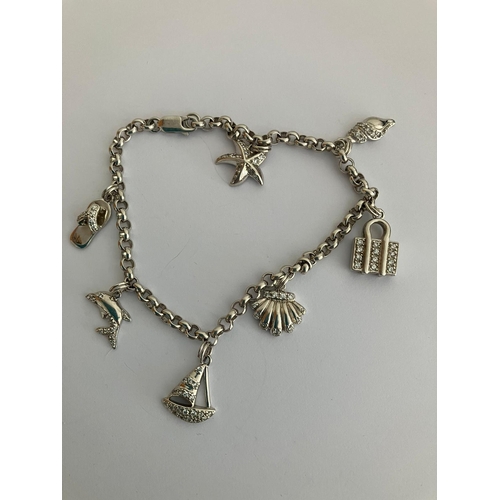 329 - SILVER BELCHER LINK CHARM BRACELET. Having zirconia set SILVER CHARMS  in the form of Dolphin, Starf... 