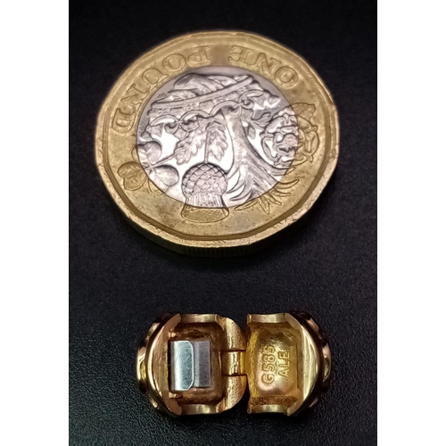 332 - A 14 K yellow gold PANDORA bead-clip with an enamelled flower on two sides. Weight: 3.2 g.