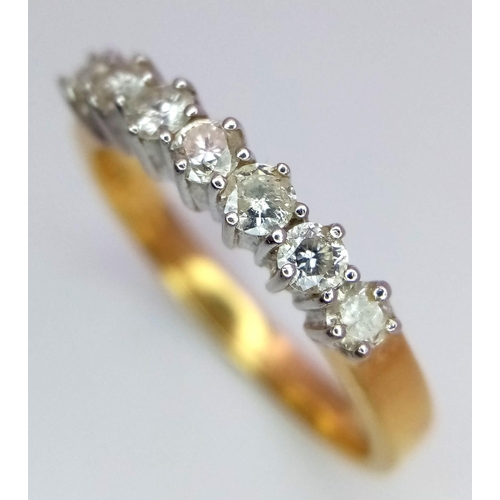 443 - An 18K White and Yellow Gold 7 Stone Diamond Ring. 0.50ctw. Size Q. 3.72g total weight. Comes with a... 