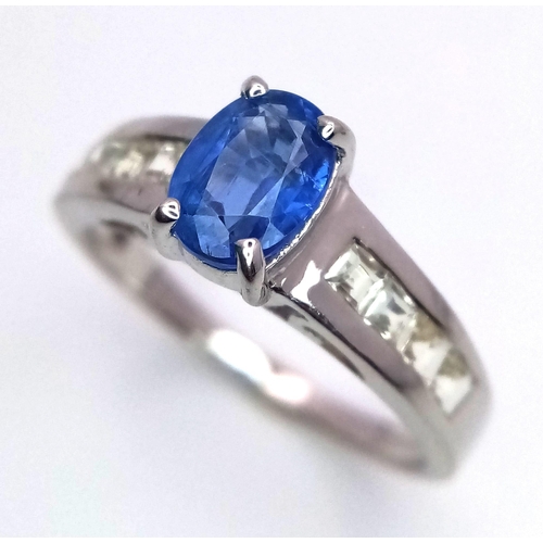 457 - A 9K White Gold Ring set with a 0.95ct Oval Kyanite with White Gemstone Shoulders. Size N. 2.9g tota... 