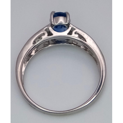 457 - A 9K White Gold Ring set with a 0.95ct Oval Kyanite with White Gemstone Shoulders. Size N. 2.9g tota... 