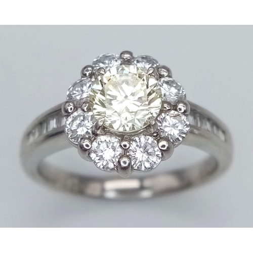 484 - AN EXQUISITE PLATINUM RING WITH A CENTRE PALE YELLOW DIAMOND SURRONDED BY HIGH QUALITY DIAMONDS SET ... 