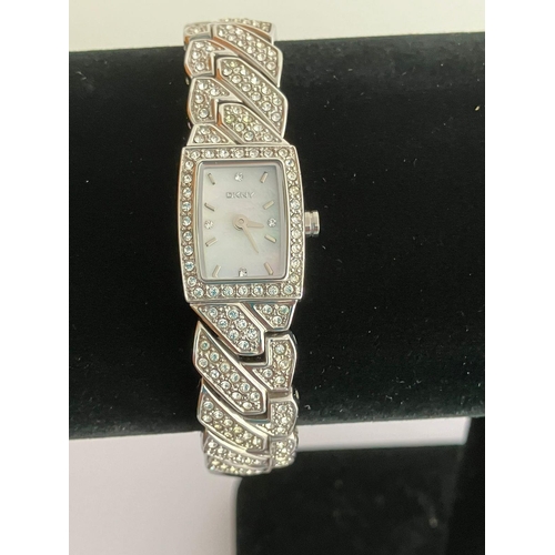 532 - Ladies DKNY Wristwatch. Model NY-4411. Finished in silver tone stainless steel with jewelled bezel a... 