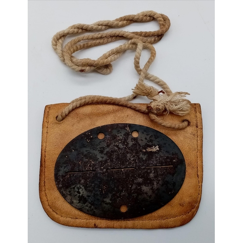 594 - WW2 German Waffen SS Panzer Grenadier Dog Tag in original leather pouch.