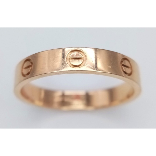 611 - A CARTIER 18K ROSE GOLD SCREW RING .    5gms   size U