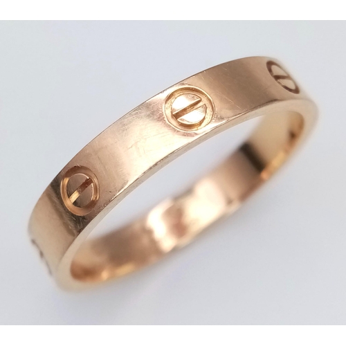 611 - A CARTIER 18K ROSE GOLD SCREW RING .    5gms   size U