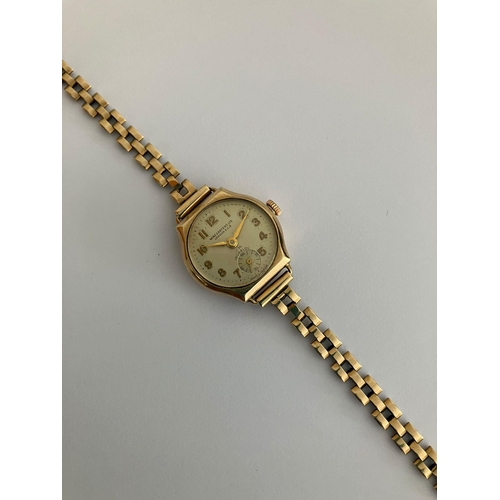 77 - Ladies Vintage 9ct GOLD 
WINEGARTENS WRISTWATCH. Complete with nine carat gold strap/bracelet. Manua... 