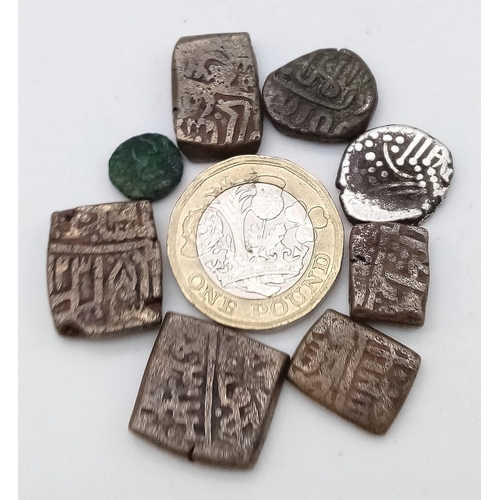 786 - A parcel of 8 Ancient coins. 
Looking at the shape, design and markings, these coins appear to be ov... 