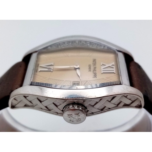 143 - A Patek Philippe 18K White Gold and Diamond Gondolo Ladies Watch. Model 4949. Original strap (slight... 