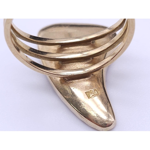 278 - WITHDRAWN A 18K GOLD 3 BAND FERTILITY RING WITH TIGERS TOOTH ENCASED IN 18K GOLD .  7.4gms   size O/... 