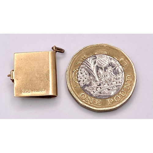 358 - A 9K Yellow Gold Scottish Book Charm. Approximately 1.5cm length, 2.4g total weight.