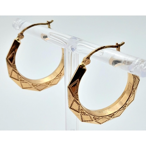 576 - A PAIR OF OCTAGONAL PATTERNED EARRINGS IN 9K GOLD  .2.3gms