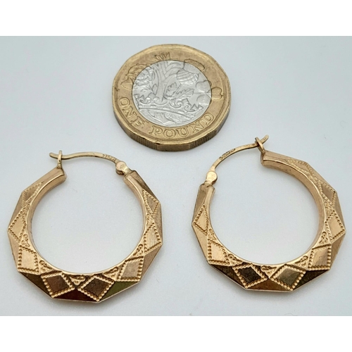 576 - A PAIR OF OCTAGONAL PATTERNED EARRINGS IN 9K GOLD  .2.3gms