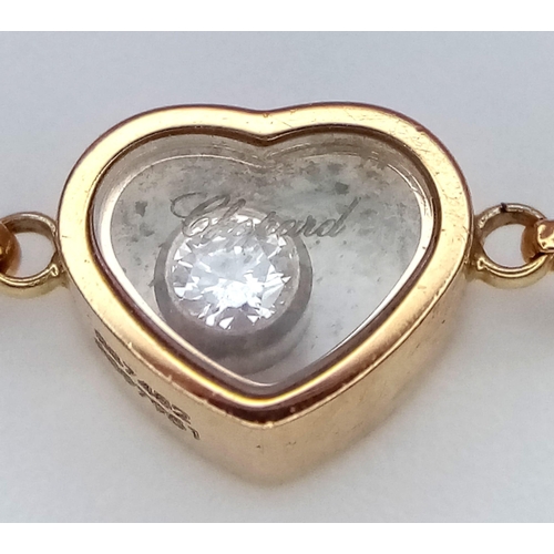 6 - An 18 K yellow gold CHOPARD bracelet with pink stone hearts and a Happy Floating Diamond. Total weig... 