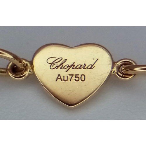 6 - An 18 K yellow gold CHOPARD bracelet with pink stone hearts and a Happy Floating Diamond. Total weig... 