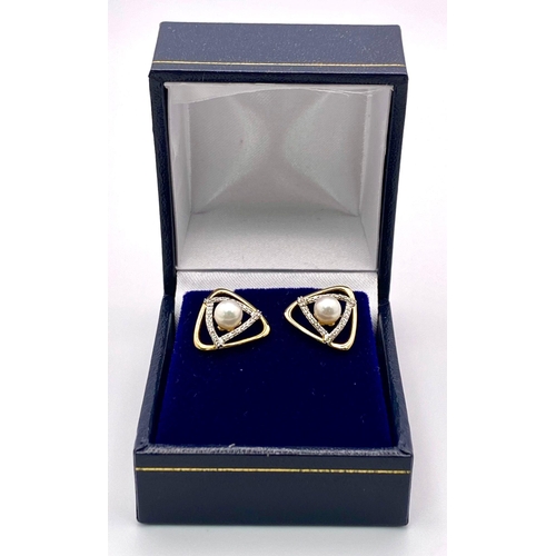 623 - A Pair of 9K Yellow Gold Triangular Cultured Pearl and Diamond Stud Earrings. Diamonds - 0.20ctw. Bo... 