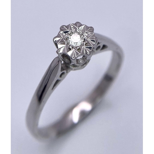 706 - 9K White gold Diamond Illusion Set Solitaire Ring. 2.3g. Size N. (dia 0.07ct). Ref: SH3214H