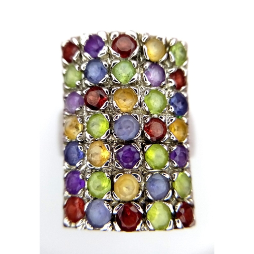 774 - An Impressive Vintage Sterling Silver and Semi-Precious Multi-Gemstone Set Ring.
Size P. The Ring me... 