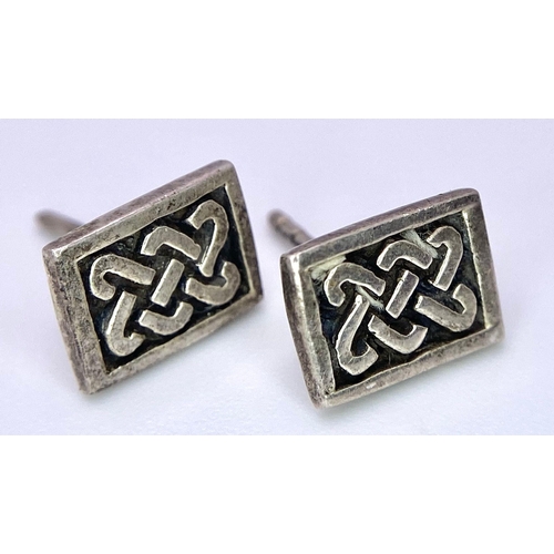 783 - A STERLING SILVER CELTIC BAND RING SIZE Q 7.7G & A CELTIC STUD EARRINGS 1.6G & A CELTIC PENDANT 32mm... 