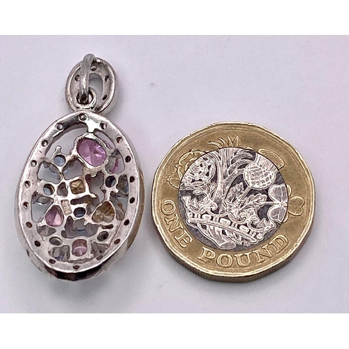 1126 - A Sterling Silver Multi Stone Set Pendant. 37mm length (including bail), 6.8g total weight.