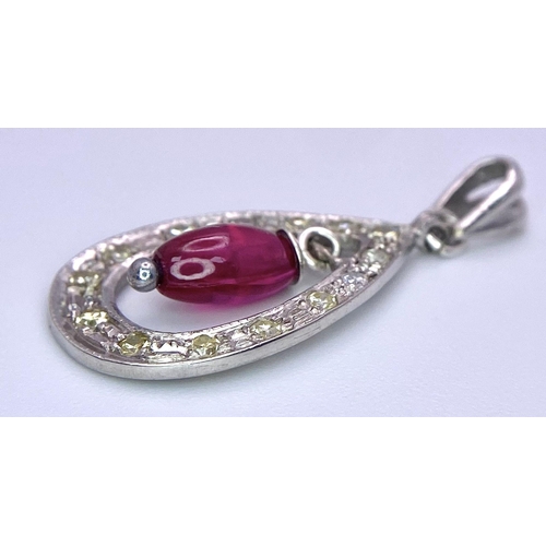 1483 - A VERY PRETTY RUBY AND DIAMOND PENDANT SET IN PLATINUM .2.3gms