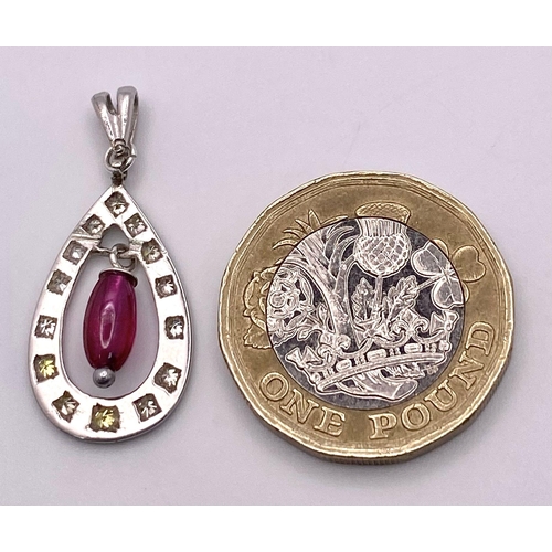 1483 - A VERY PRETTY RUBY AND DIAMOND PENDANT SET IN PLATINUM .2.3gms