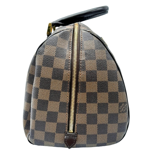 176 - A Louis Vuitton Damier Ebene 'Ribera' Handbag. Leather exterior with two rolled leather handles, gol... 