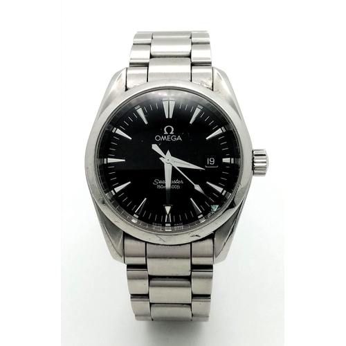 192 - An Omega Seamaster Aqua Terra Quartz Gents Watch. Stainless steel bracelet and case - 36mm. Black di... 