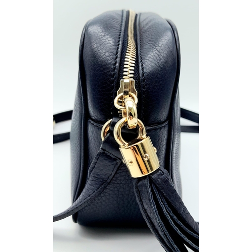 316 - A Gucci Blue Soho Disco Crossbody Bag. Grained leather exterior with the signature tassel, stitched ... 