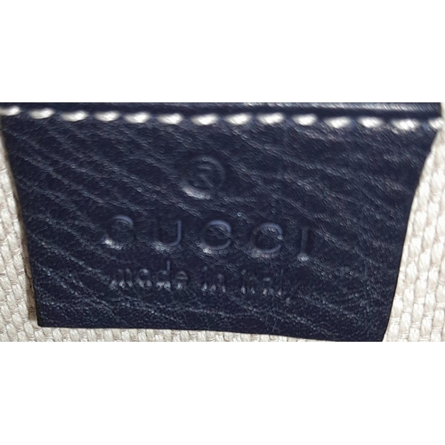 316 - A Gucci Blue Soho Disco Crossbody Bag. Grained leather exterior with the signature tassel, stitched ... 