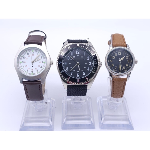 781 - A Parcel of Three Unworn Military Homage Watches. 
1) 1980’s Canadian Airforce Navigator (46mm)
2) 1... 