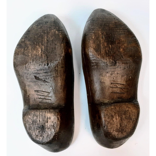 782 - Pair of Dutch clogs that have been crudely engraved by a German soldier to mark the successful invas... 