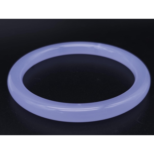 794 - A Chinese Lavender Jade Thin Bangle. 6cm inner diameter. 8mm width.