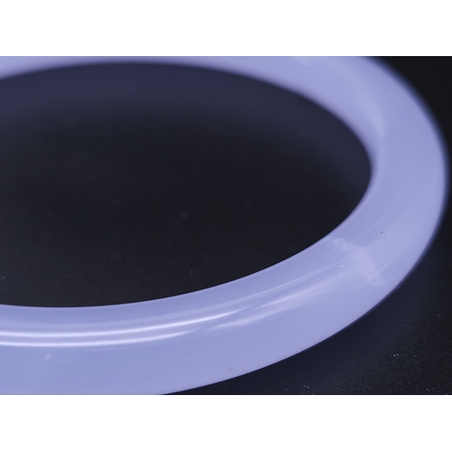 794 - A Chinese Lavender Jade Thin Bangle. 6cm inner diameter. 8mm width.