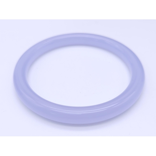 794 - A Chinese Lavender Jade Thin Bangle. 6cm inner diameter. 8mm width.