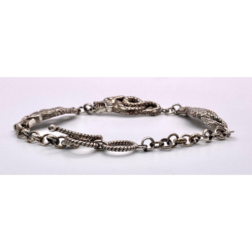 873 - A Very Unique Sterling Silver Dragon Detail T- Bar Bracelet. 20cm Length, 1cm Width. Gross Weight 15... 