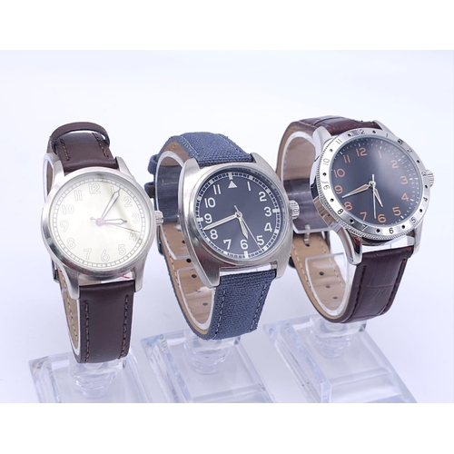 917 - A Parcel of Three Unworn Military Homage Watches.
1) 1960’s French Navy Pilot (41mm)
2) 1970’s Briti... 