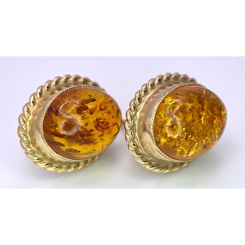 1080 - A PAIR OF 9K GOLD AMBER EARRINGS .  3.1gma