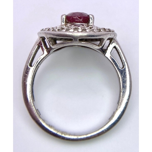 1383 - A VERY ATTRACTIVE SILVER RING WITH CENRAL RUBY STONE .     4.6gms   size O