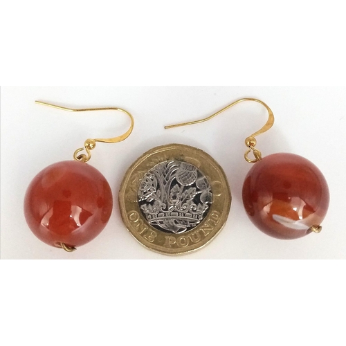 1397 - A PAIR OF RED JADE BALL EARRINGS IN YELLOW METAL .