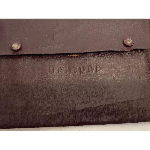 142 - A German WW2 Waffen SS Soldbuch in a Wehrpas Wallet. The Soldbuch (standard military issue) served a... 