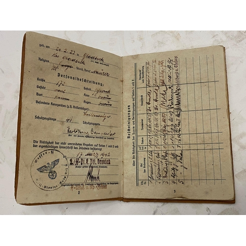 142 - A German WW2 Waffen SS Soldbuch in a Wehrpas Wallet. The Soldbuch (standard military issue) served a... 