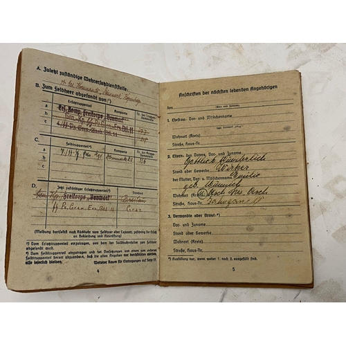 142 - A German WW2 Waffen SS Soldbuch in a Wehrpas Wallet. The Soldbuch (standard military issue) served a... 